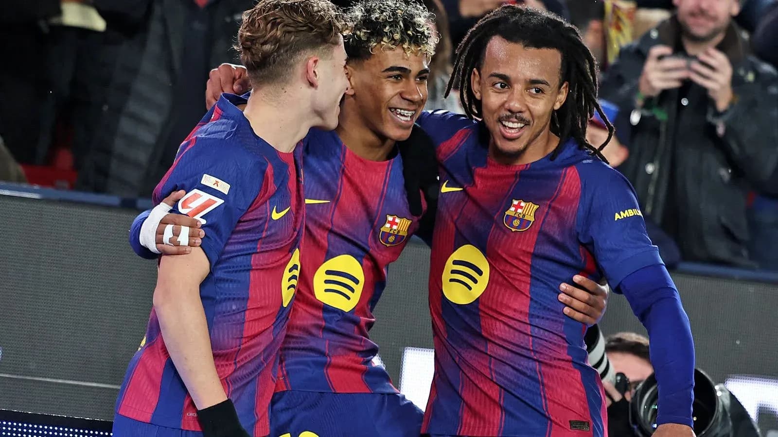 Barcelona players celebrating a goal on the field