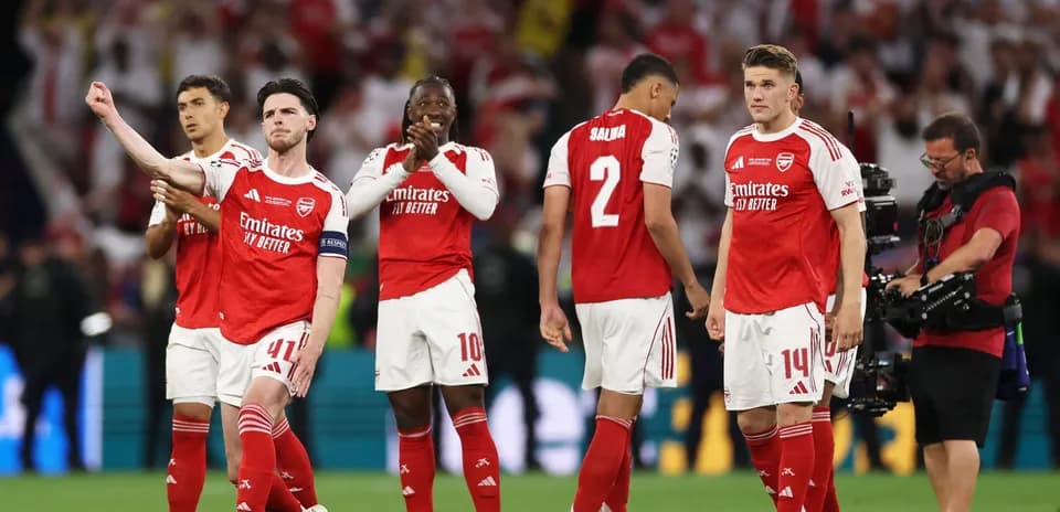 Arsenal players celebrating after match victory