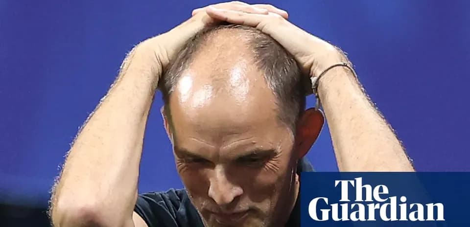 Coach with hands on head during match