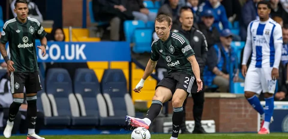 Player kicking ball during football match