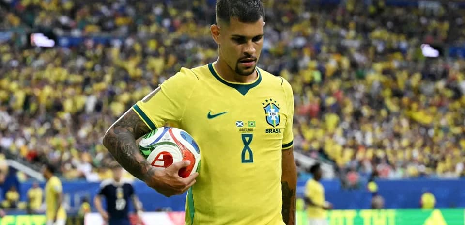 Brazillian player holding a ball during match