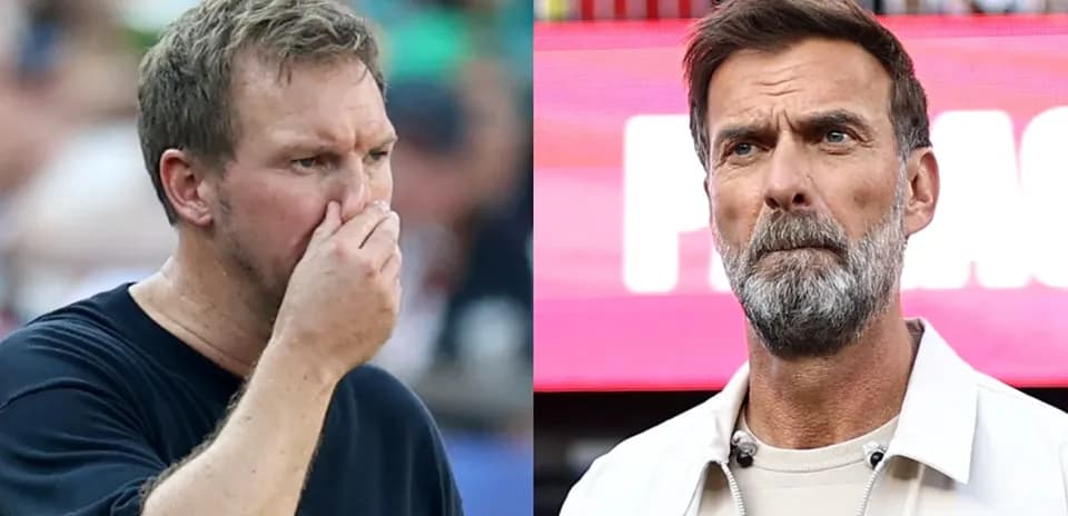 Two coaches observing the game on the sidelines