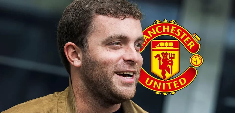 Shirtless man smiling with Manchester United logo