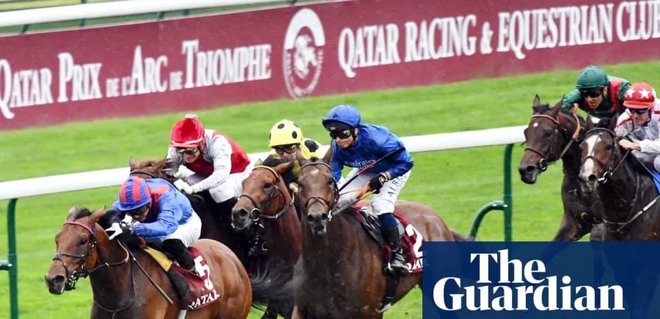 Jockeys racing on horses at Arc de Triomphe event