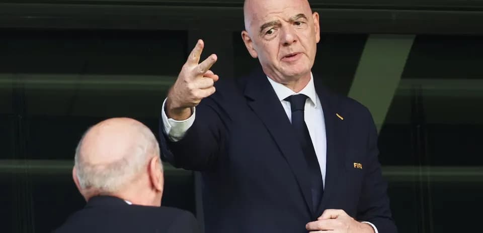 FIFA president speaking at event with colleague