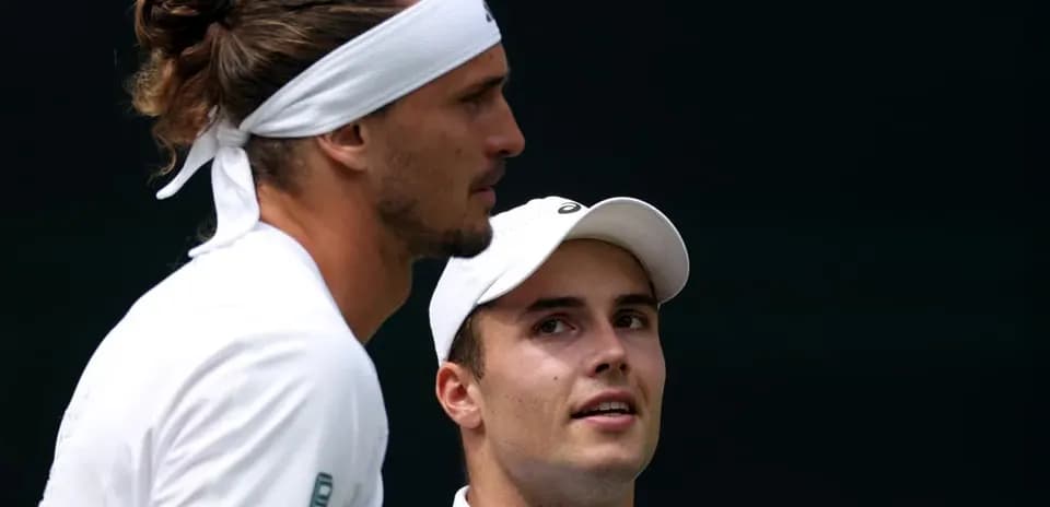 Tennis players discussing during match at Wimbledon