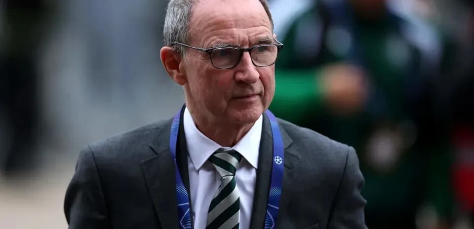 Men's football manager arriving at a stadium