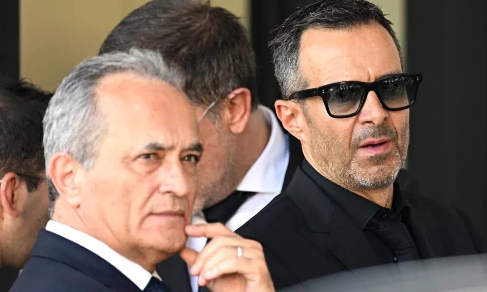 Two men in suits outside a building