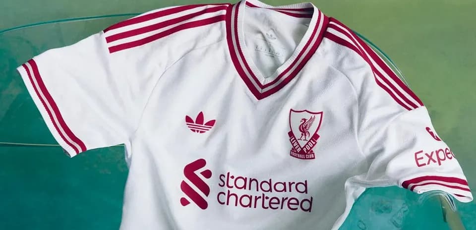 Liverpool FC white jersey with red accents displayed