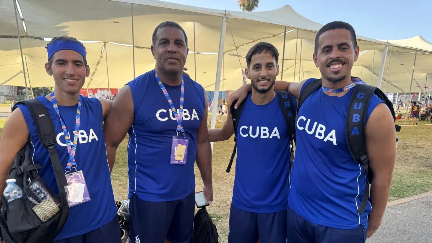 Cuban athletes posing together in blue jerseys