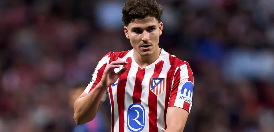 Atletico Madrid player gesturing during match