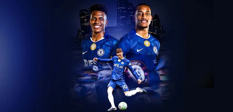 Chelsea players posing with ball in team jerseys
