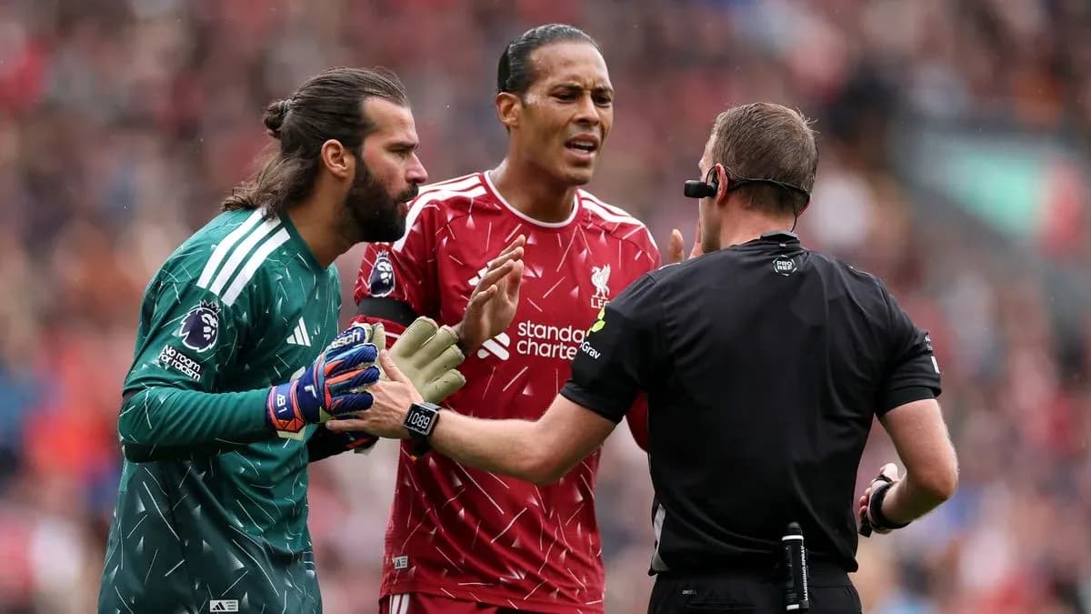Liverpool players arguing with the referee during match