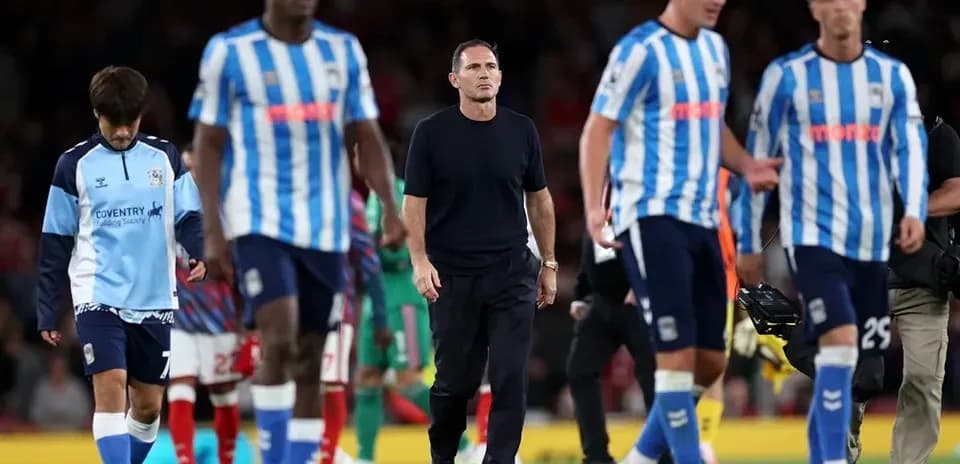 Huddersfield Town players leaving the pitch after match