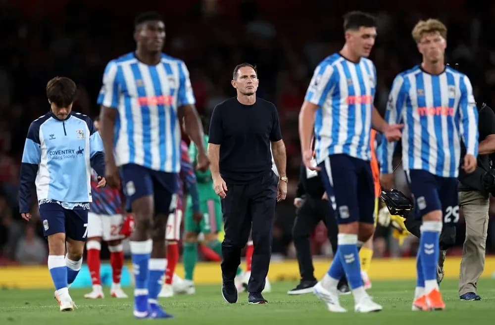 Huddersfield Town players leaving the pitch after match