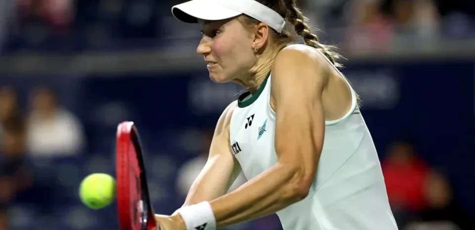 Tennis player hitting a forehand during match