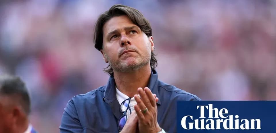 Men's football coach looking up with clasped hands