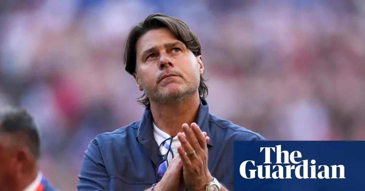 Men's football coach looking up with clasped hands