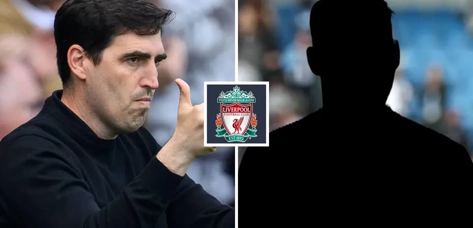 Coach gesturing during match with Liverpool logo