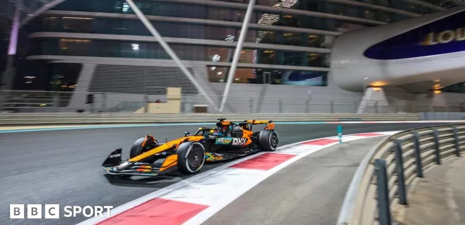 Formula 1 car racing at night on track