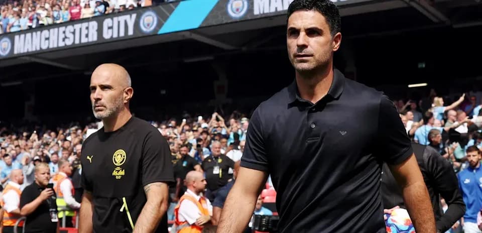 Trainers walking towards the pitch during match