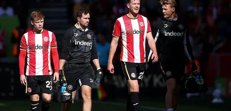 Brentford players leaving the pitch after match