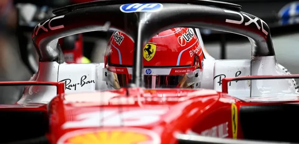 F1 driver in Ferrari car during pit stop