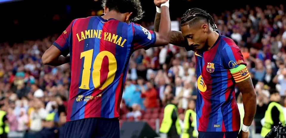 Lamine Yamal celebrating goal with teammate at Camp Nou