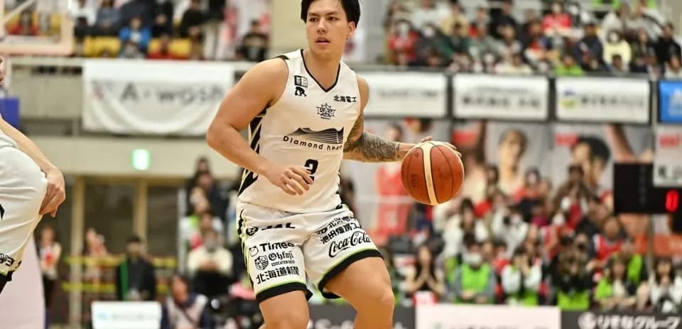 Basketball player dribbling ball during match