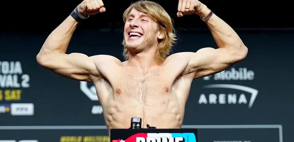 Fighter flexing muscles at weigh-in event