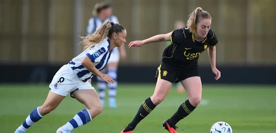 Two players contesting the ball during a match