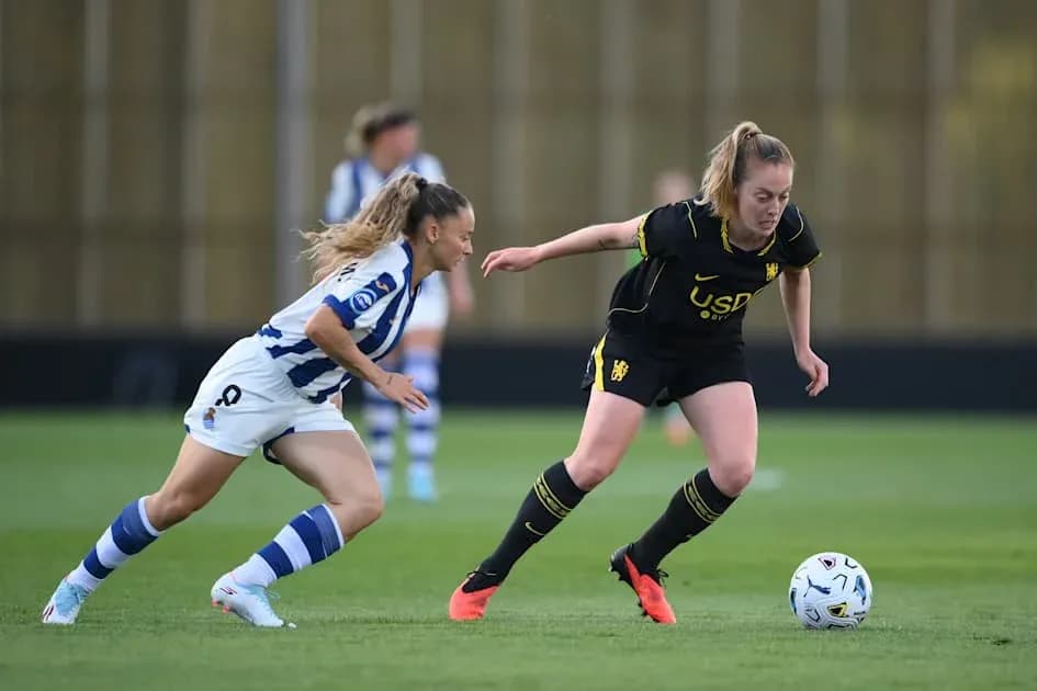 Two players contesting the ball during a match
