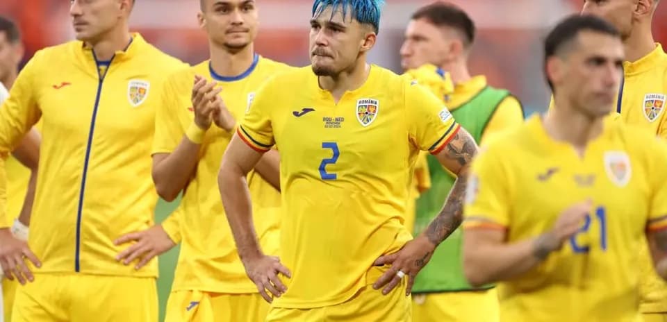 Romania players in yellow jerseys after match