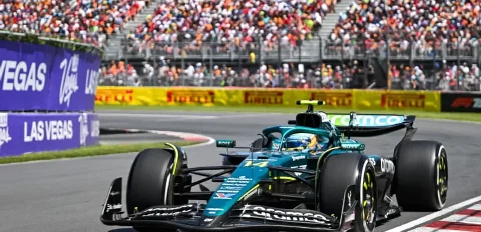 Formula 1 car racing on track with spectators