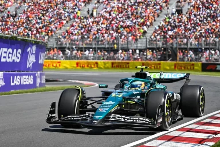 Formula 1 car racing on track with spectators
