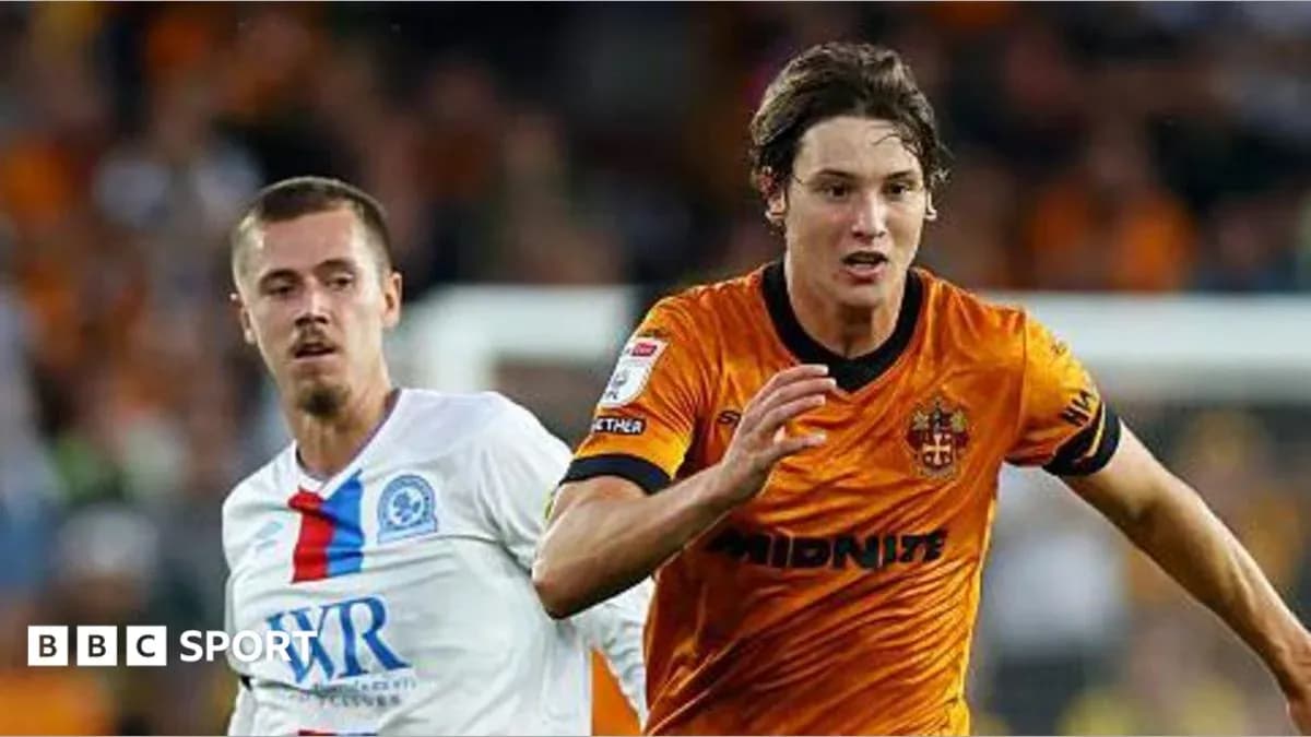 Two players competing for the ball during match