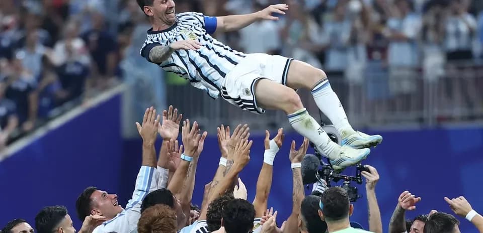 Messi celebrated by teammates after victory