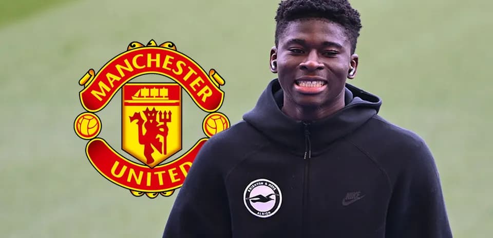 Young player smiling with Manchester United logo