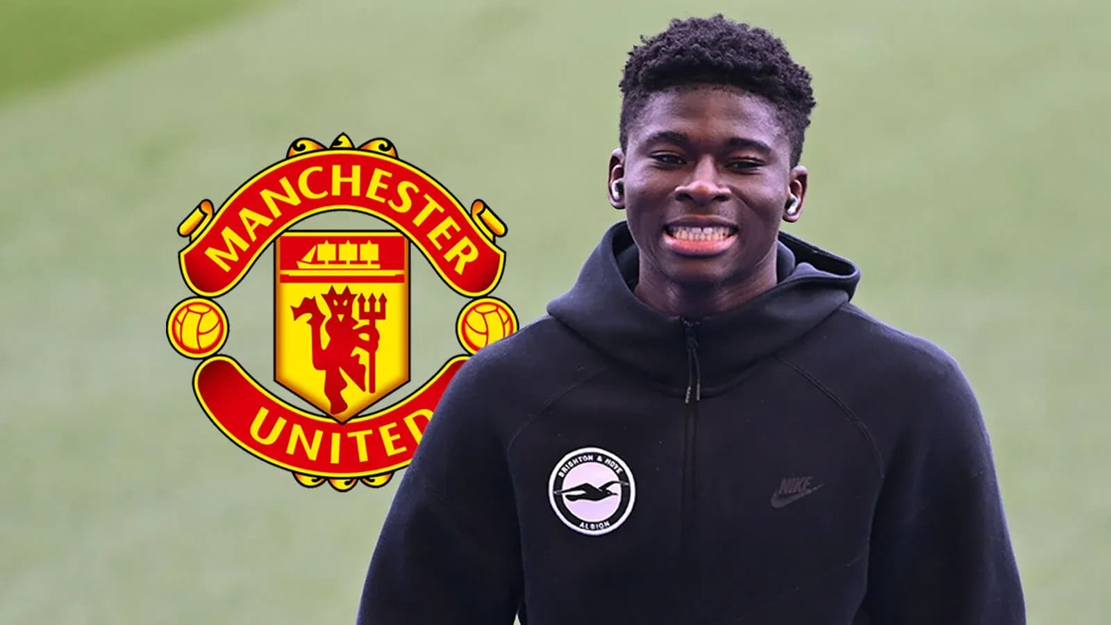 Young player smiling with Manchester United logo