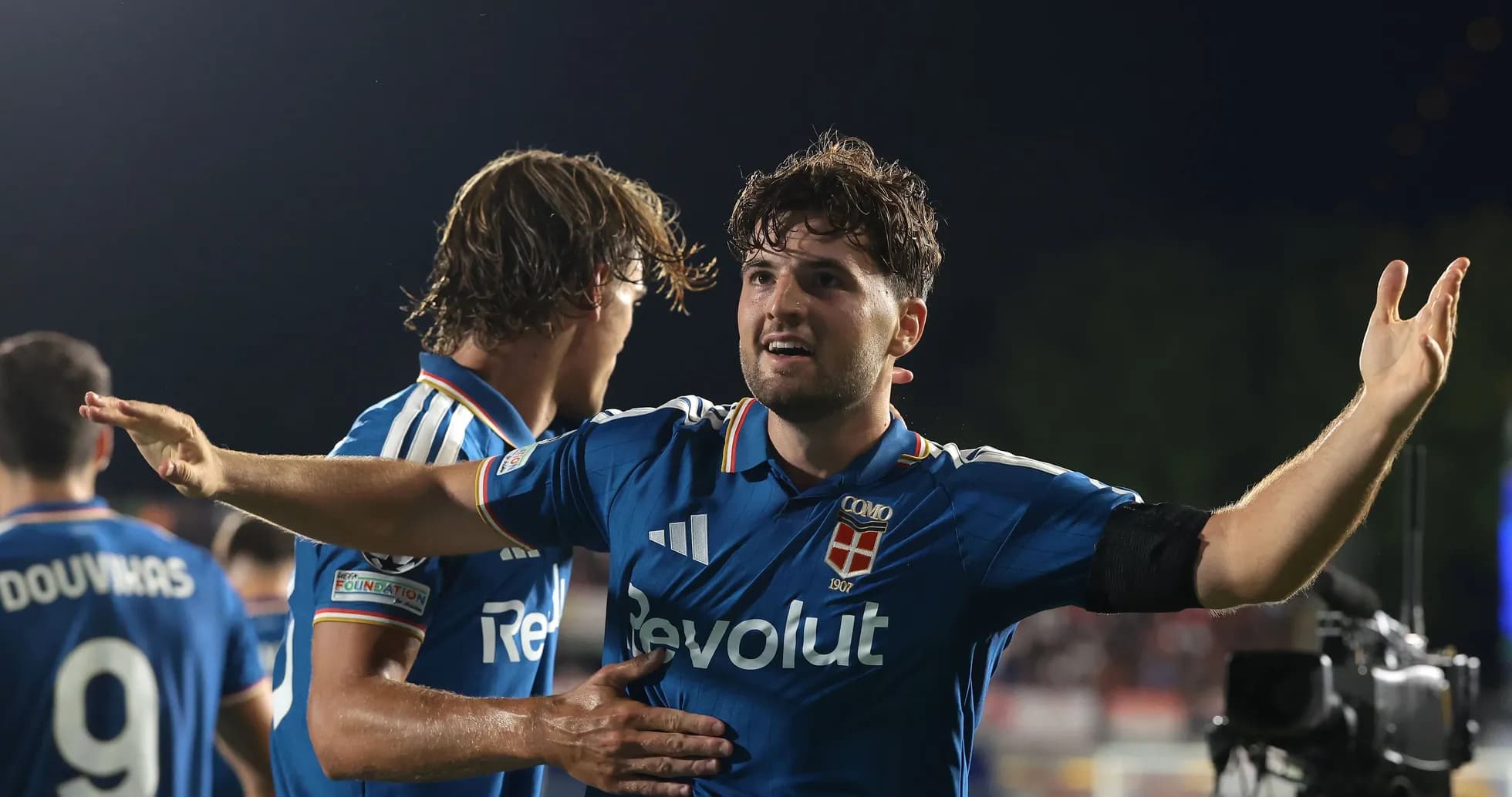 Football players celebrating after scoring a goal