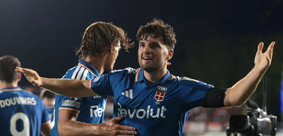 Football players celebrating after scoring a goal