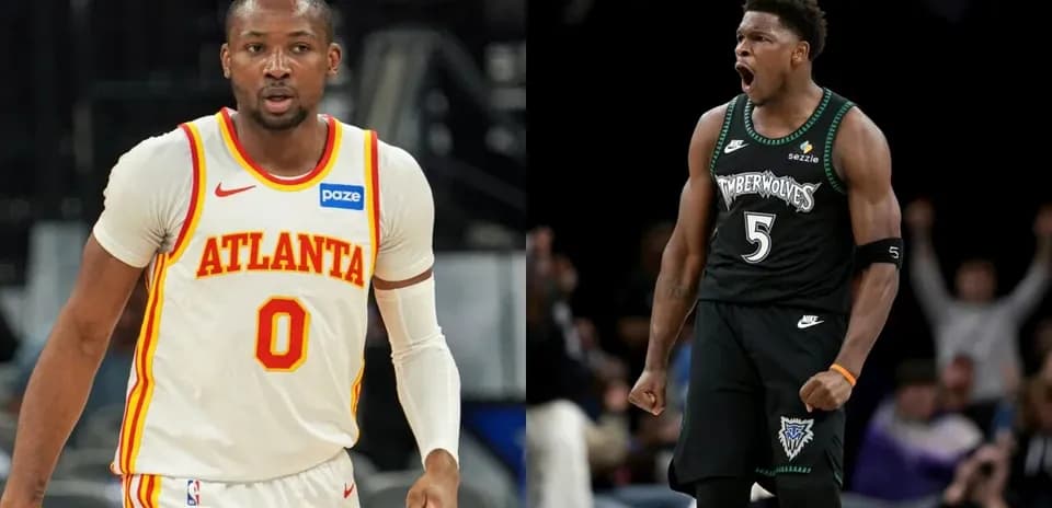 Two basketball players in team jerseys celebrating