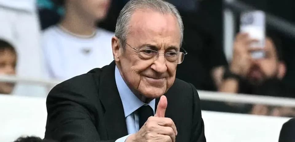 Person giving thumbs up in stadium setting