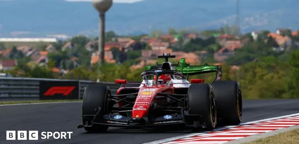 Formula 1 car racing on a track with hills