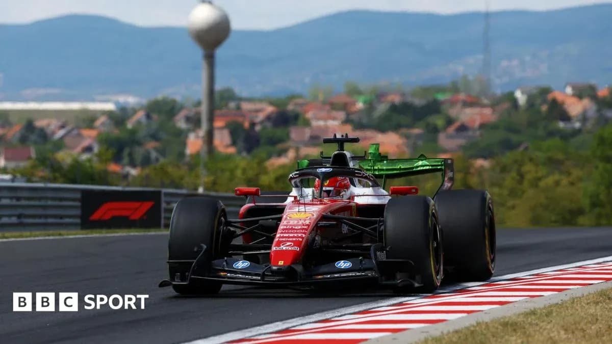 Formula 1 car racing on a track with hills