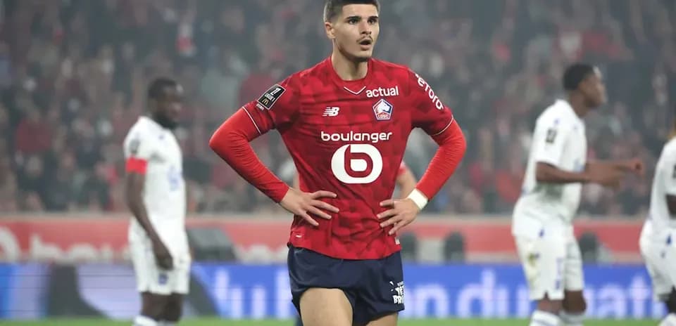 Lille player standing with hands on hips during match