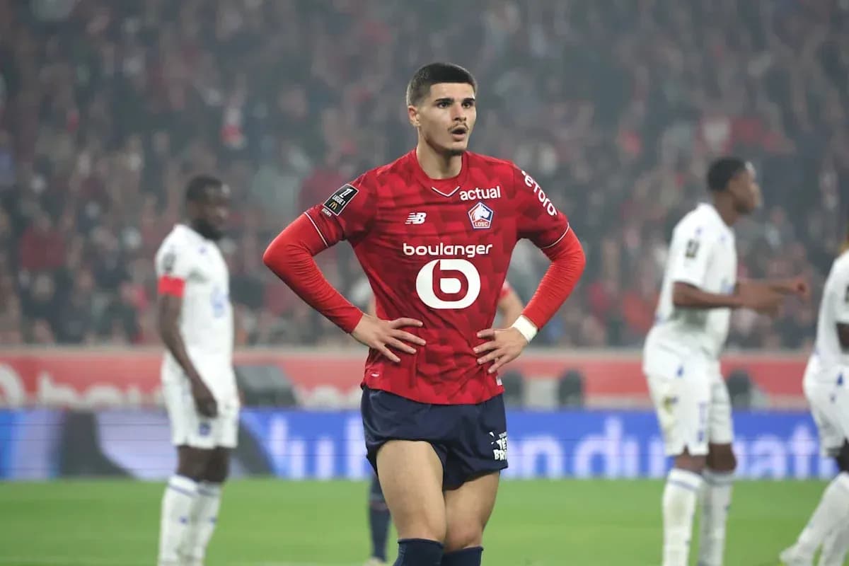 Lille player standing with hands on hips during match