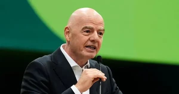 FIFA president speaking at a podium during event
