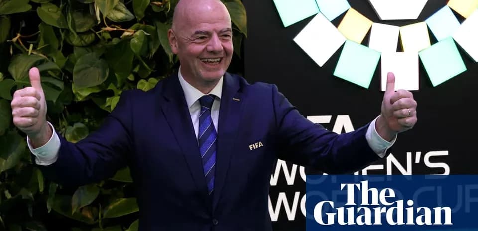 FIFA president gesturing thumbs up at event