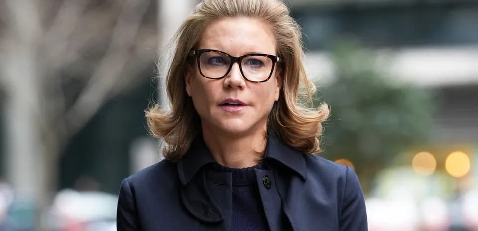 Woman with glasses walking in urban setting